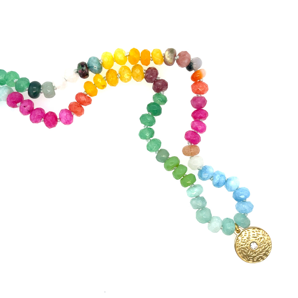 Gemstone necklace with gold plated charm. 