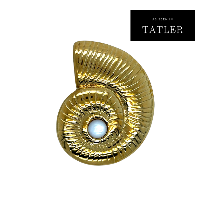 Amelie Accessory Pendant – gold nautilus shell pendant with a pearl center, as seen in Tatler