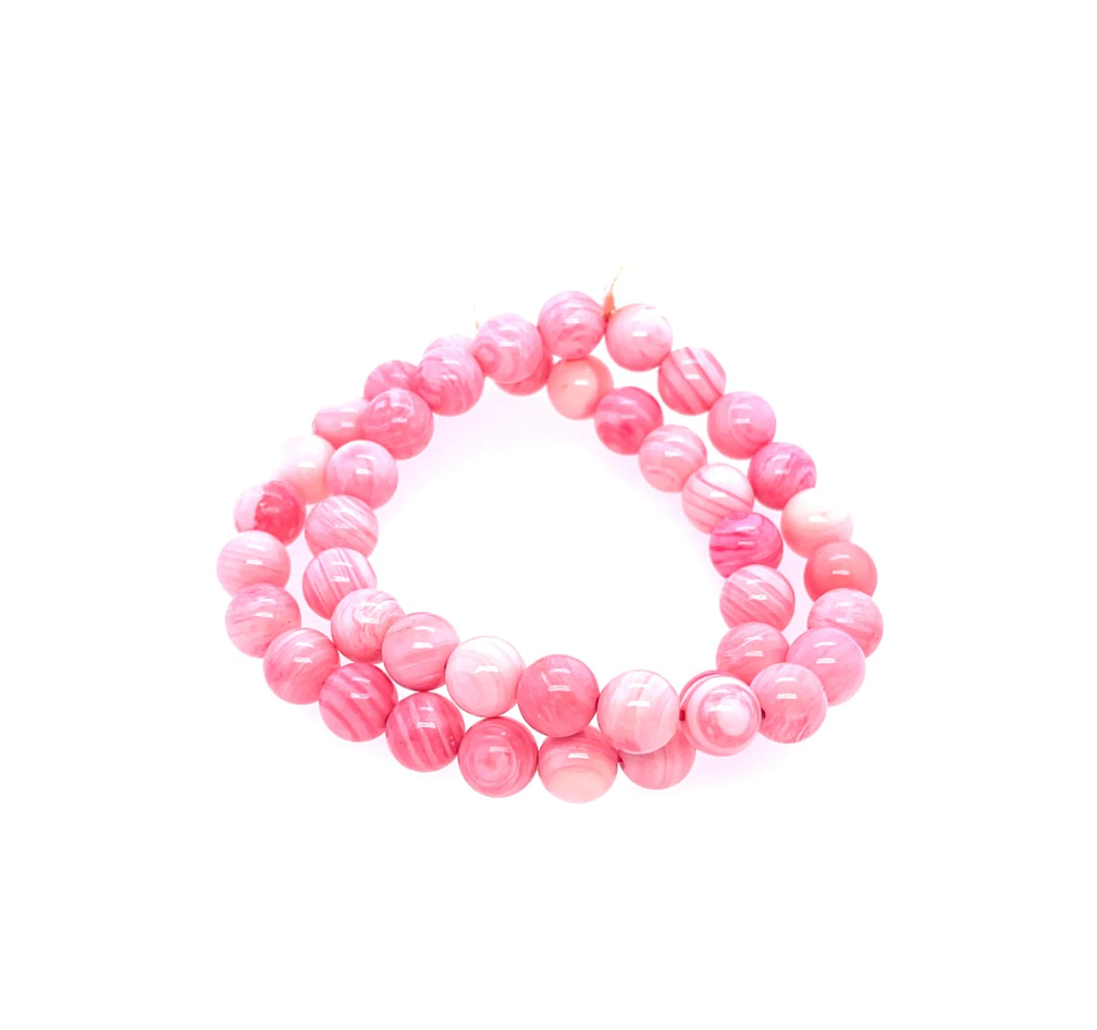 A bright piece to bring a natural twist to any stack. This pop of pink is the perfect addition to add to any bracelet stack. 