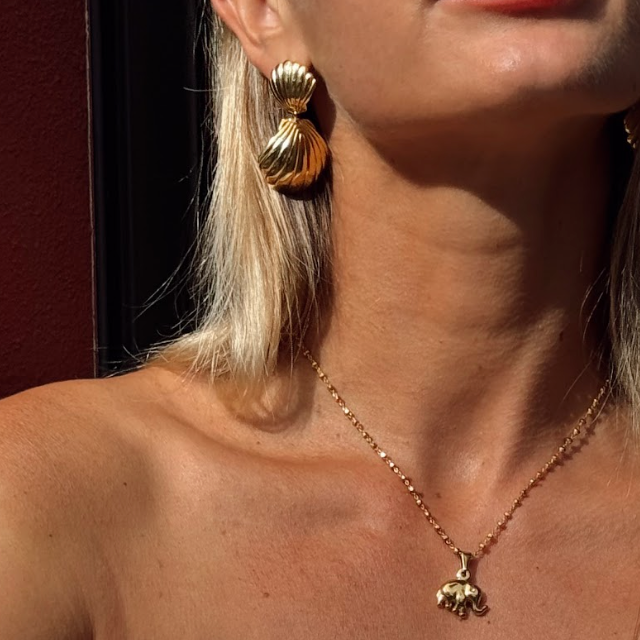 These beautifully designed double-shell pair of earrings are a glamorous touch to any outfit. 