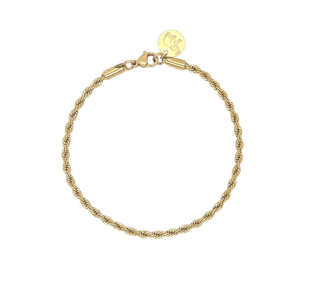 A gold rope chain bracelet with a lobster clasp and a small round gold tag engraved with an elephant.