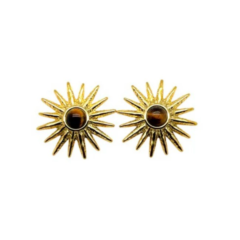 Gold sun-shaped earrings with a central Tiger's Eye on a white background