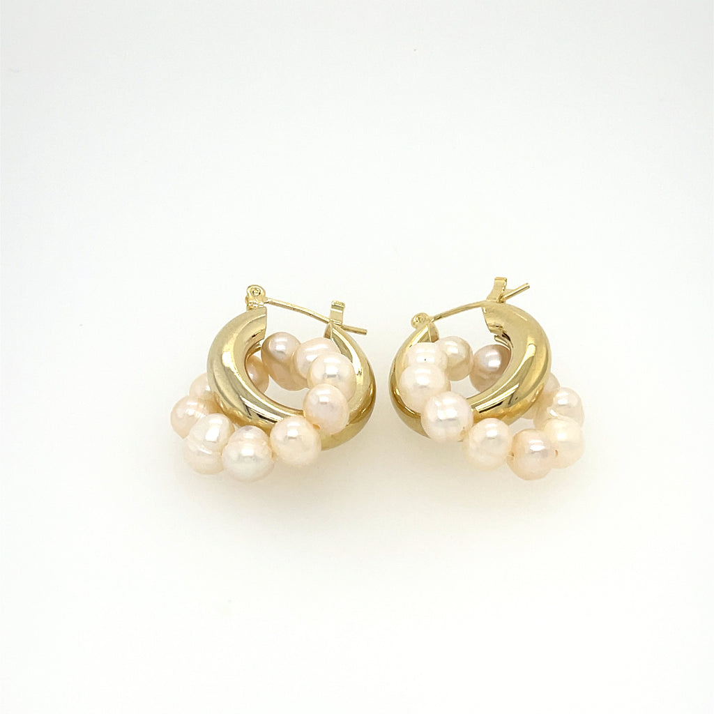 1 inch gold plated hoop and pearl earring.