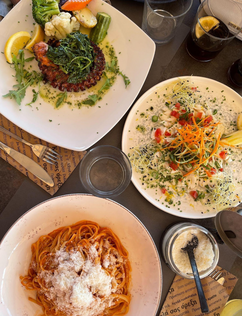 Savor sunset dining at Apsithia in Santorini, a hidden gem with panoramic sea views and Greek flavors.