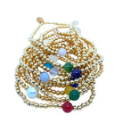 Gold plated 4mm bead with a birth stone center stone.