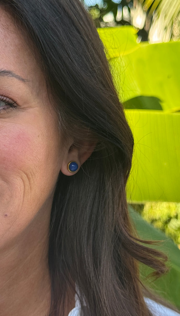 A nod to timeless elegance, these gold-plated stainless steel stud earrings feature vibrant lapis lazuli stones, known for their deep celestial blue and natural charm. Set in a sleek round bezel, the rich lapis contrasts beautifully against the warm gold, creating a refined pop of color.