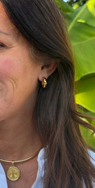 Meet Gemora – your new go-to gold mini hoops with just the right amount of shine. These gold-plated stainless steel earrings are accented with vibrant colored stones for a playful yet polished look.