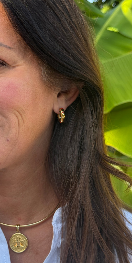 Meet Gemora – your new go-to gold mini hoops with just the right amount of shine. These gold-plated stainless steel earrings are accented with vibrant colored stones for a playful yet polished look.