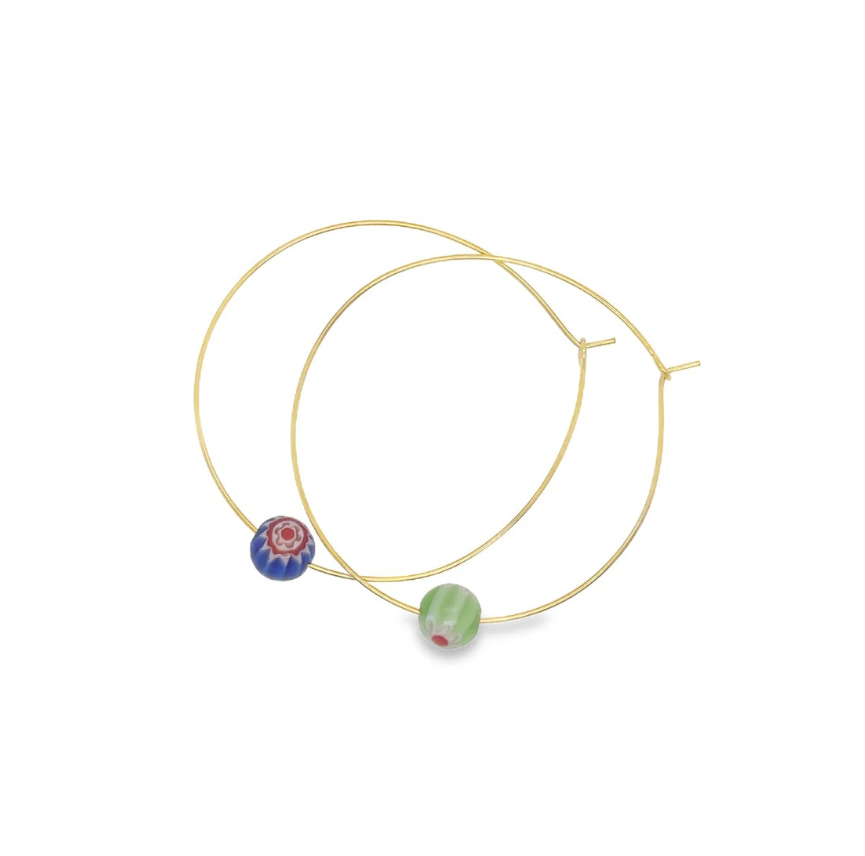 Gold hoop earrings with colorful Millipore beads on a white background