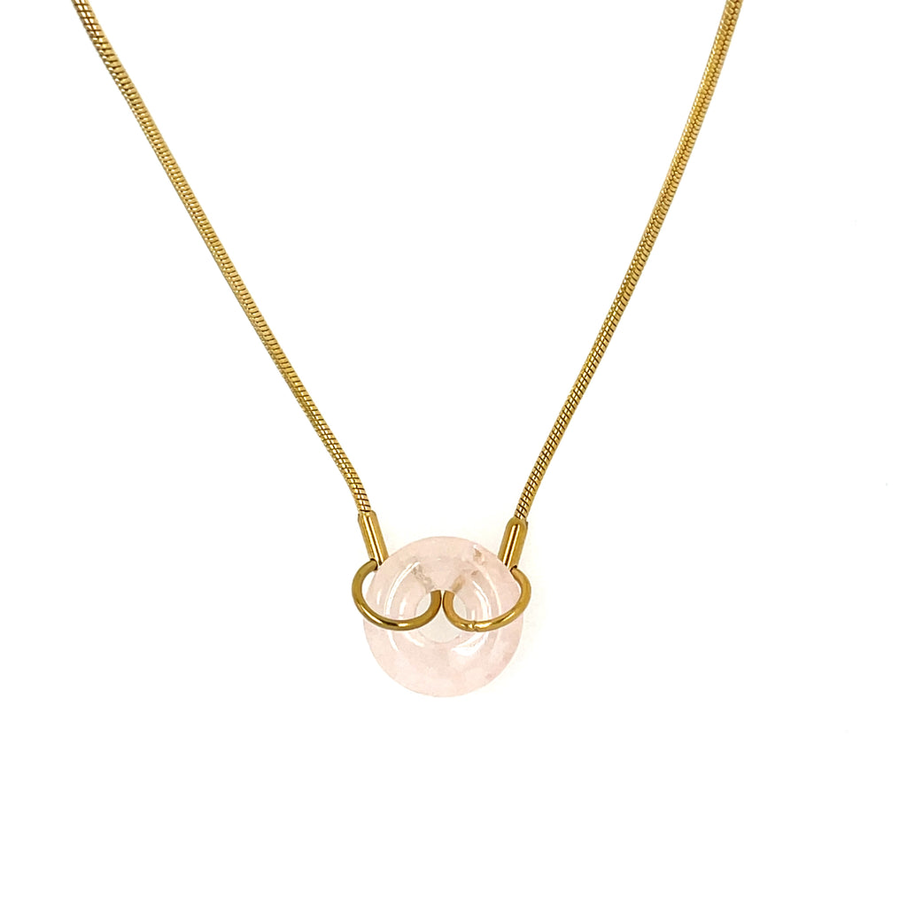 Gold plated 18 inch chain with light pink stone pendant.