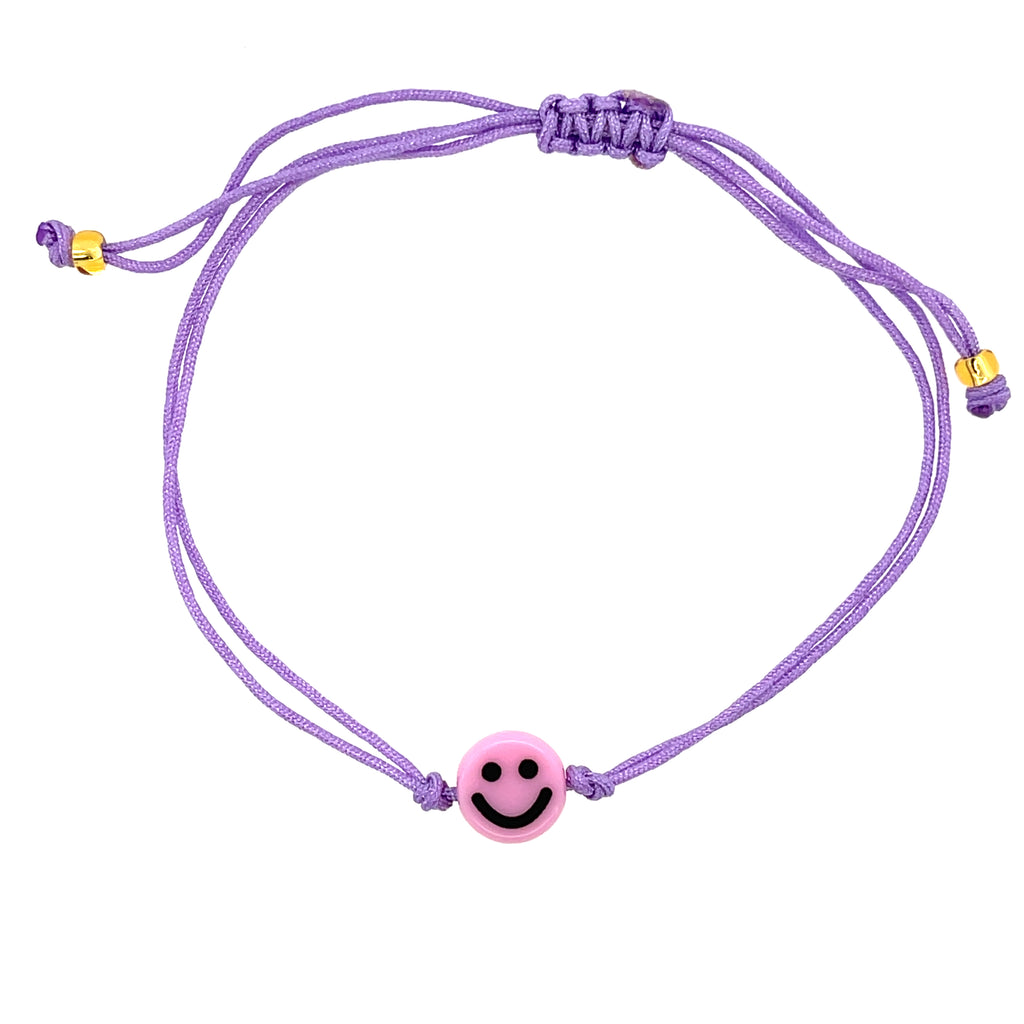 Yellow smiley face charm bracelet with adjustable purple drawstring cord for a fun, bold accent.
Playful and colorful accessory—perfect for stacking, gifting, or daily wear.