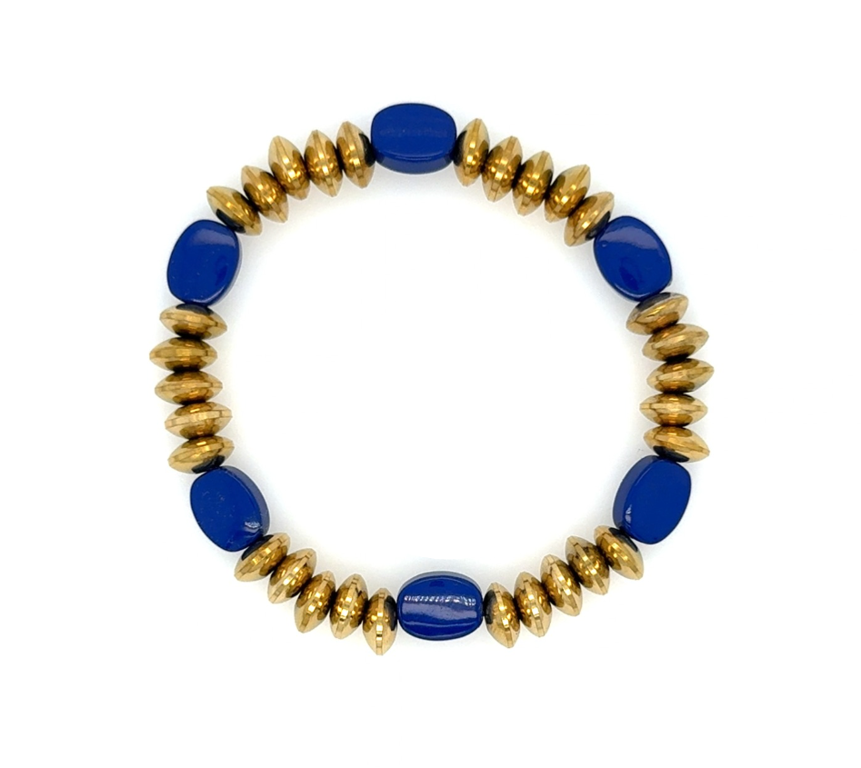 A beaded stretch bracelet featuring alternating glossy cobalt blue oval beads and textured metallic gold disc beads, displayed on a clean white background.