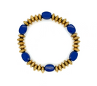 A beaded stretch bracelet featuring alternating glossy cobalt blue oval beads and textured metallic gold disc beads, displayed on a clean white background.