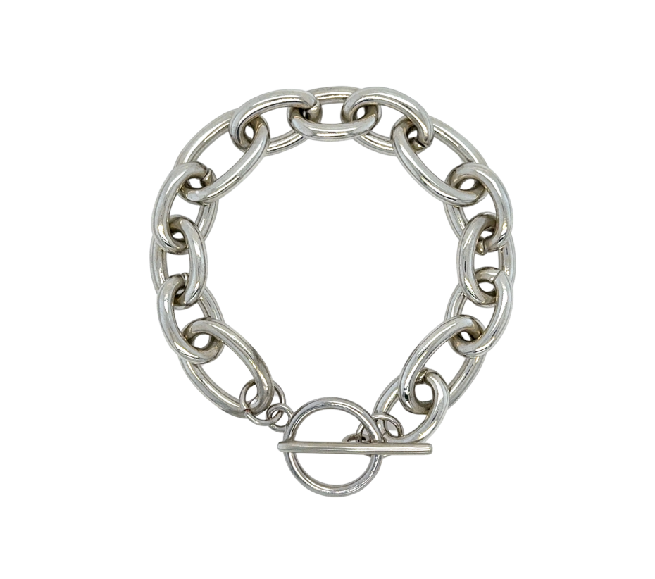 A silver-toned chunky chain bracelet with a toggle clasp, shown on a plain white background.