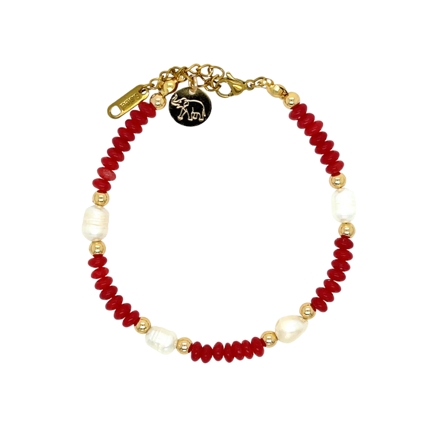 Bracelet with red and white beads on a white background
