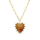 Gold necklace with a heart-shaped pendant on a white background