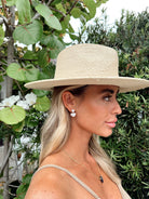 Pearl stud earrings with 0.5-inch top pearl and dangling heart pearl charm in a classic finish.
Chic and feminine accessory—ideal for bridal looks or everyday elegance.