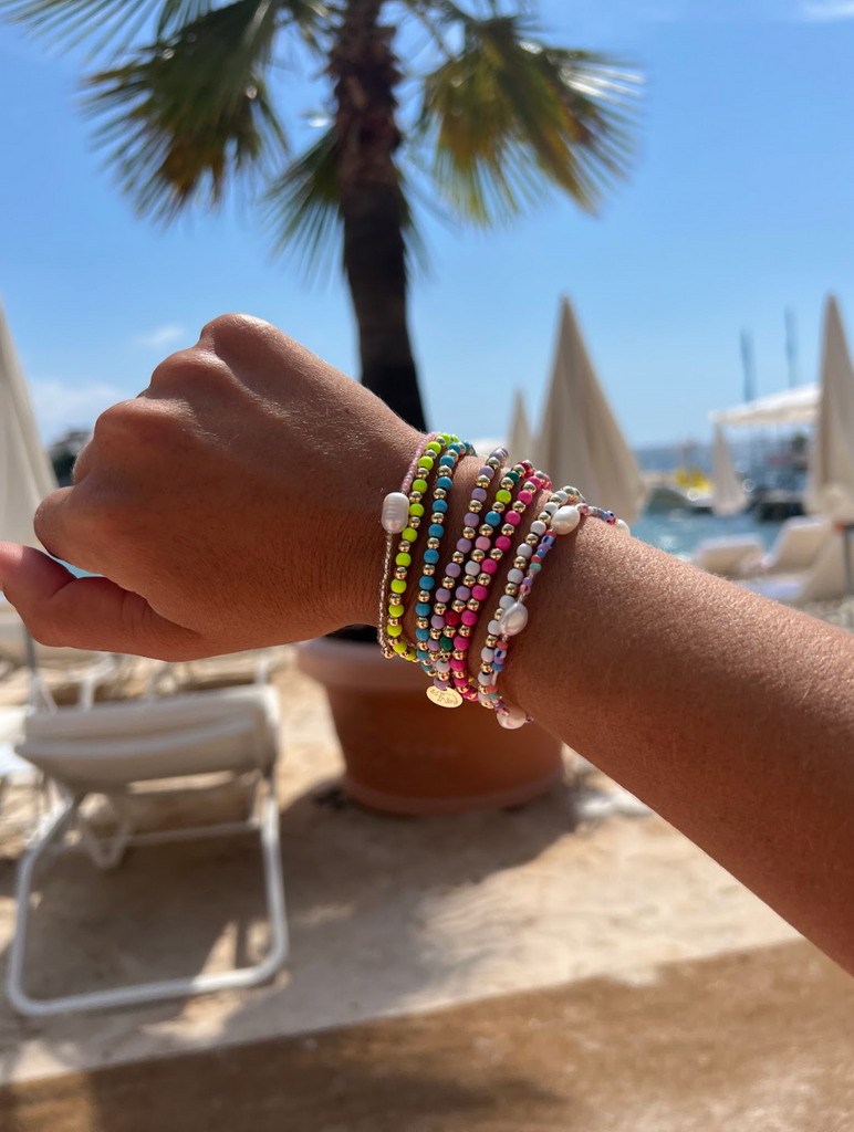 Set of 2 bracelets with 0.5-inch pearl beads and multi beads, sized at 2.5-inch diameter for a layered look.
Trendy and lightweight stack—great for mixing textures and enhancing casual or formal styles.