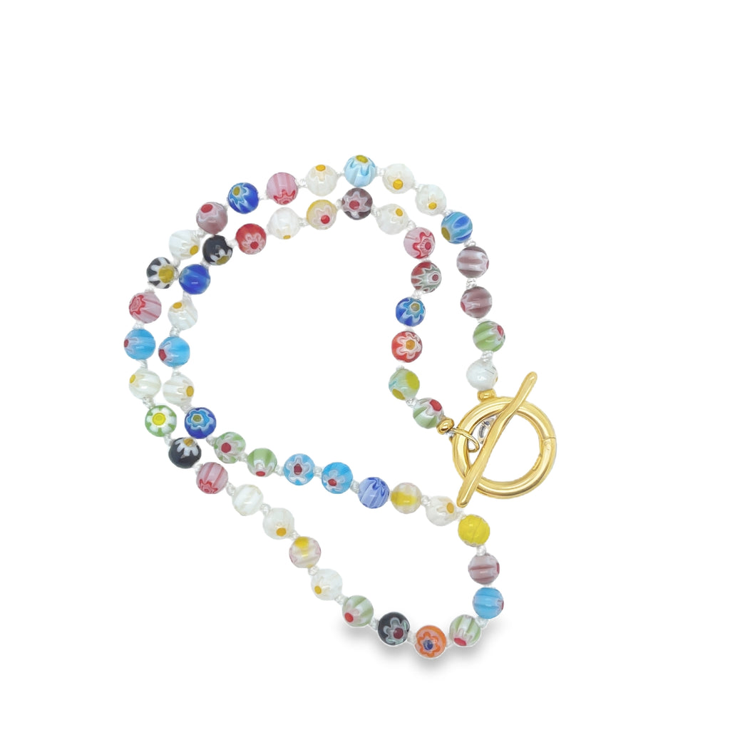 Colorful Millefiori bead necklace with vibrant glass floral patterns, 18-inch length for a classic fit.
Handcrafted Venetian-style jewelry—perfect for boho fashion, layering, or standout gifts.
