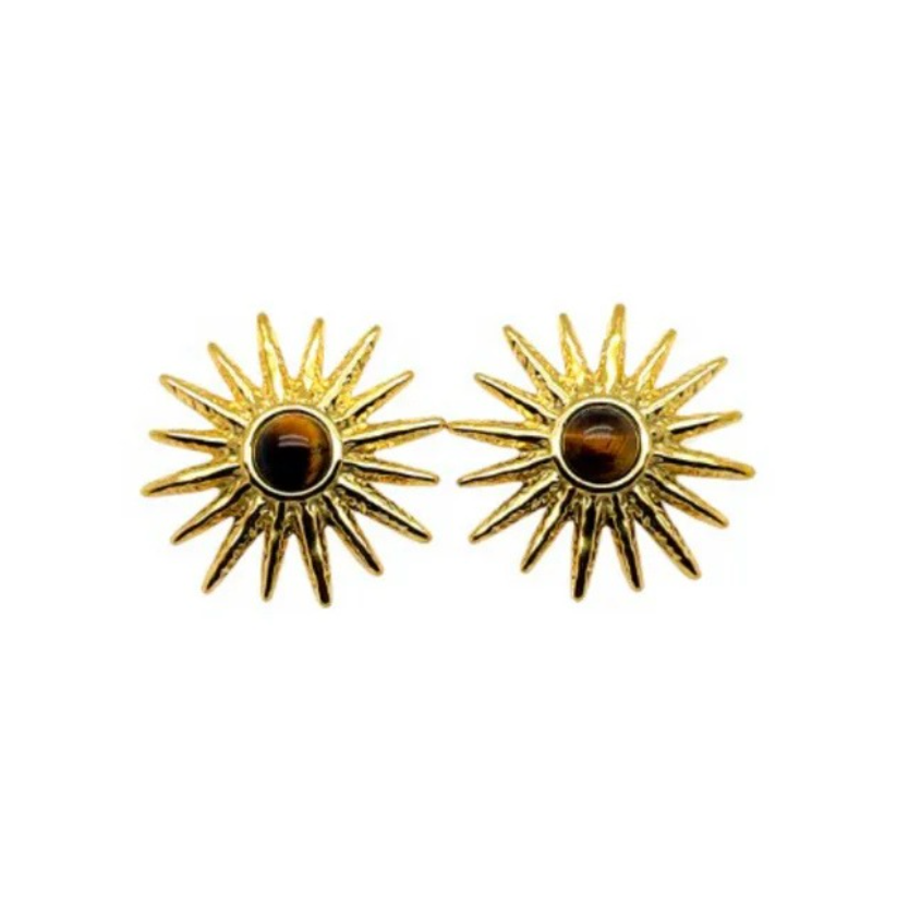 Gold sun-shaped earrings with a central Tiger's Eye on a white background