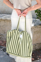 Our signature green striped canvas tote is here.