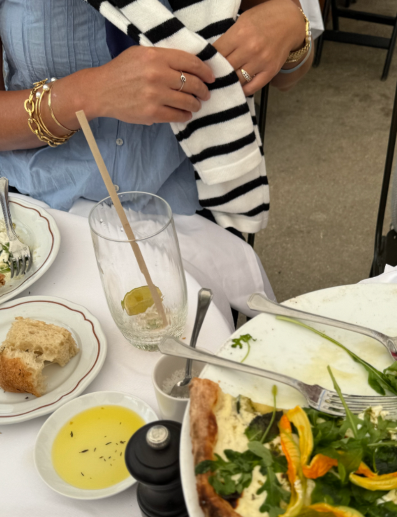 Enjoy chic outdoor dining at LouLou Café, set beside the Louvre with stunning garden views.