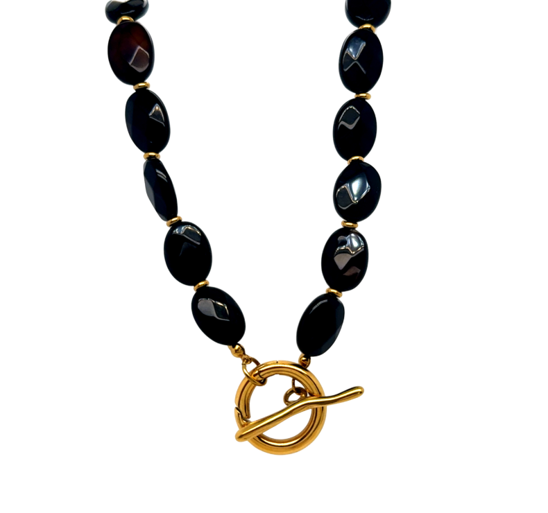 Necklace with black beads and a gold clasp to fit any love, ellison pendant