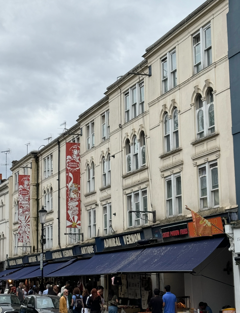 Stroll through vibrant Portobello Road, famed for its antique market, colorful houses, and vintage charm.