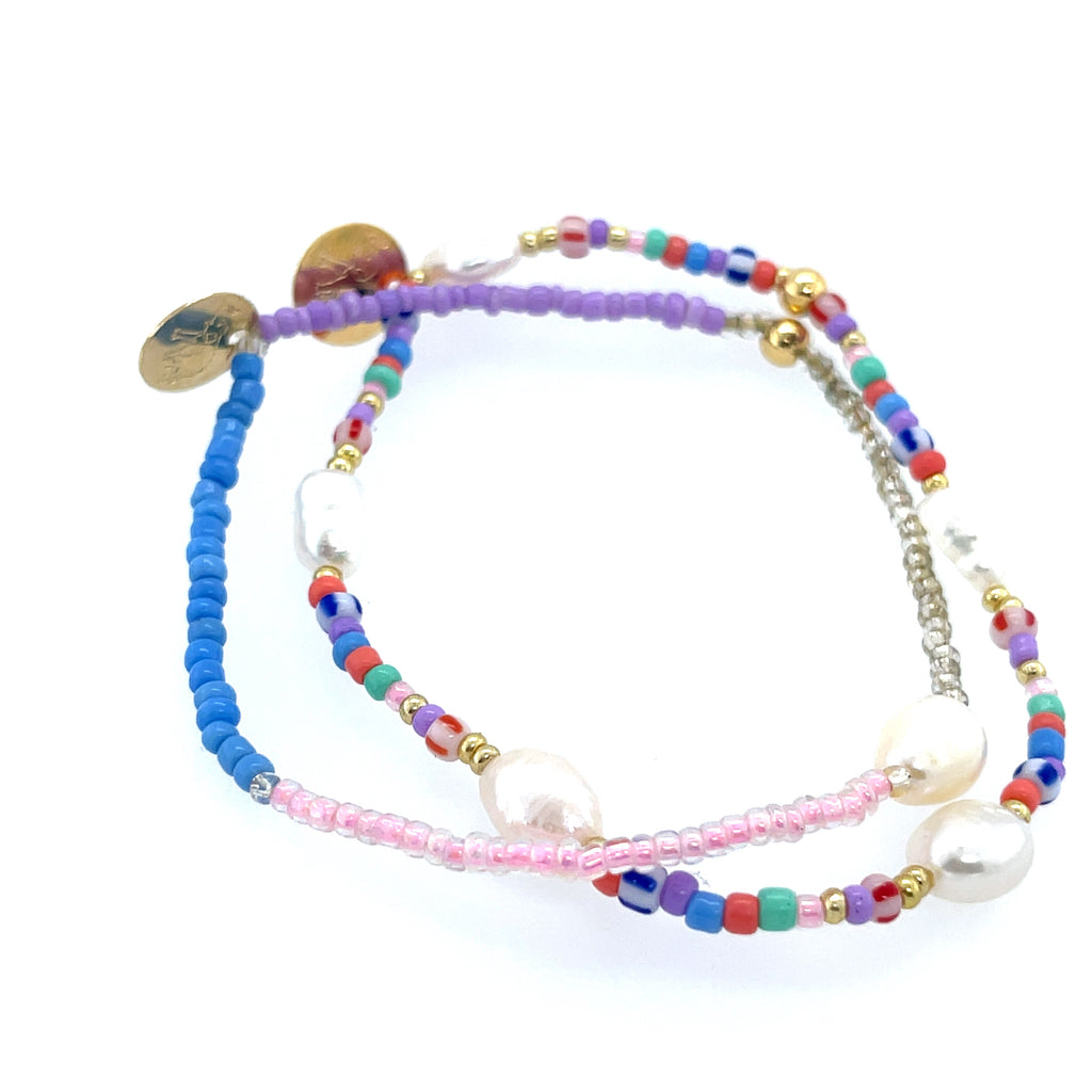 Two stacked bracelets combining 0.5-inch pearl beads and colorful multi beads, 2.5-inch diameter each.
Stylish and versatile accessory—ideal for everyday wear, festivals, or special occasions.