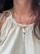 Gold plated 16 inch chain featuring one natural shell brushed with gold, elegant beach-inspired necklace